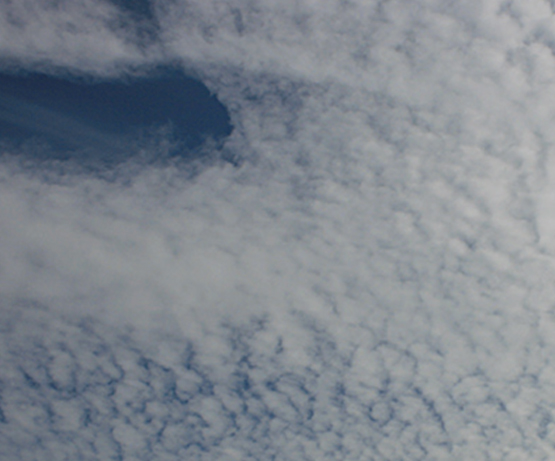 Altocumulus: Translucent bands or patches in a relatively continuous layer.